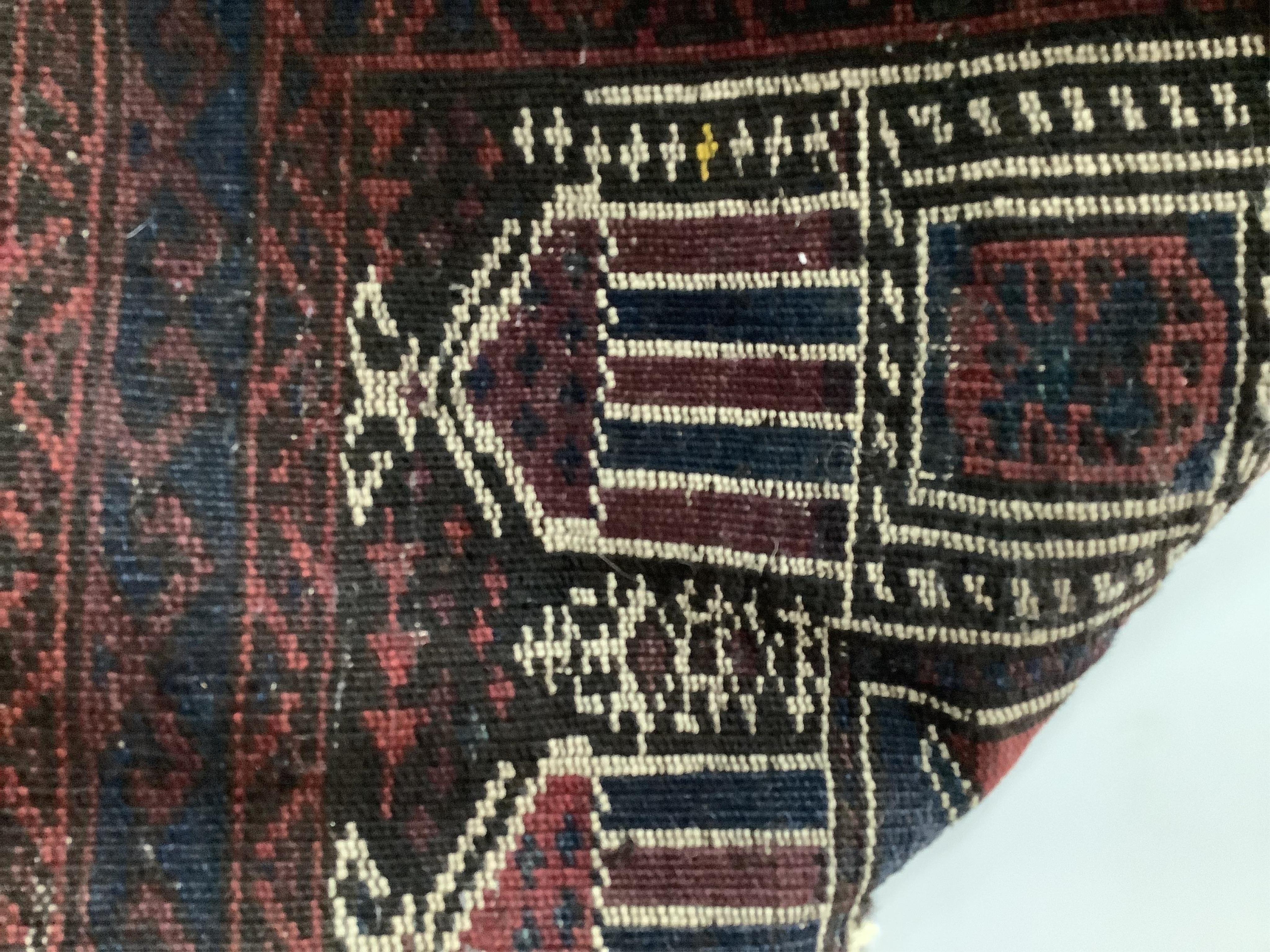 A Baluch prayer rug, 130 x 78cm. Condition - poor